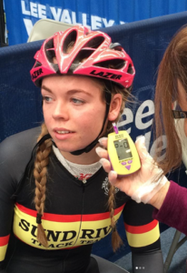Cyclist has a blood lactate sample taken from her ear