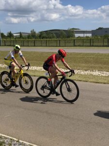 A female cyclist who uses polarized training leads a man.