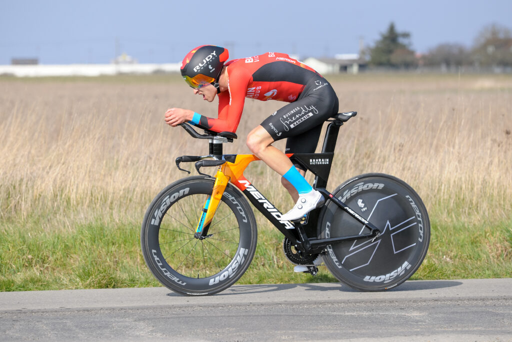 A cyclists riding a time trial on an aerodynamic bicycle